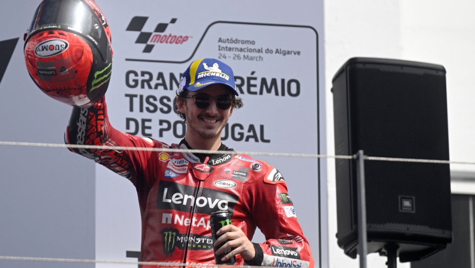 Ducati Italian rider Francesco Bagnaia celebrates on the podium winning the MotoGP race of the Portuguese Grand Prix at the Algarve International Circuit in Portimao, on March 26, 2023. (Photo by PATRICIA DE MELO MOREIRA / AFP)