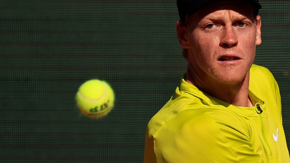 Italy's Jannik Sinner eyes the ball as he plays against Italy's Lorenzo Musetti during the Monte-Carlo ATP Masters Series tournament quarter final tennis match in Monte Carlo on April 14, 2023. (Photo by Valery HACHE / AFP)