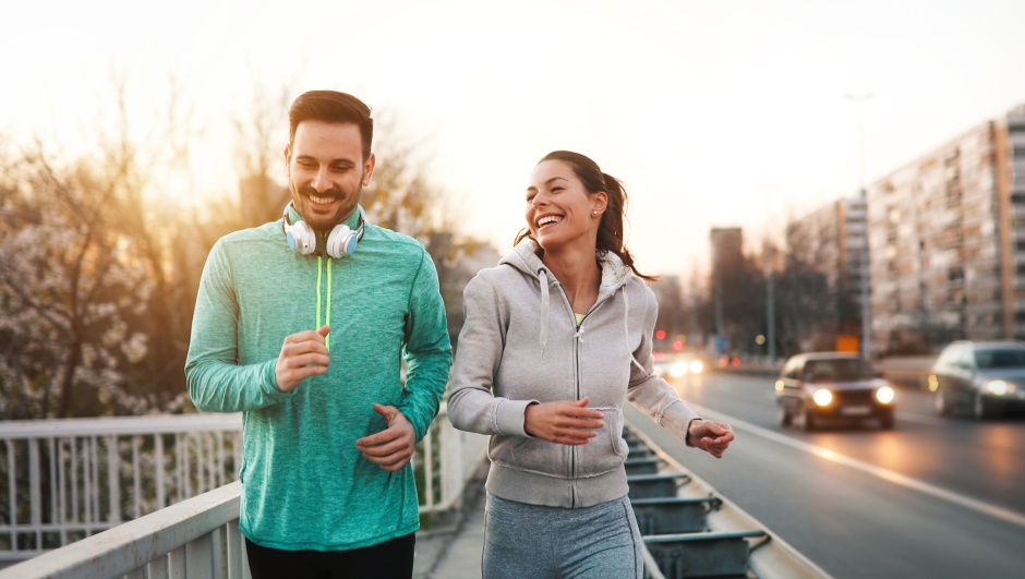 Couple jogging and running outdoors in nature