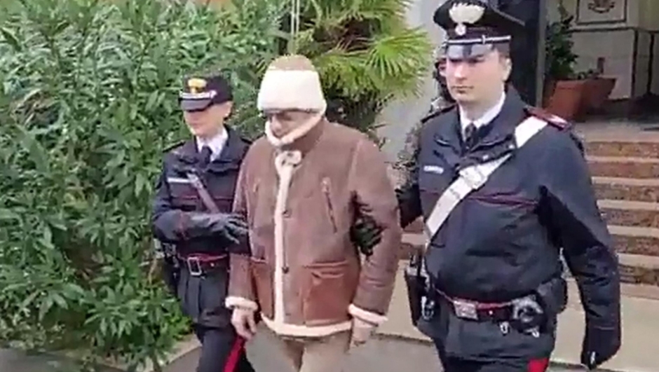 A handout photo made available by Italy's Carabinieri shows a video frame of the Mafia boss Matteo Messina Denaro (C), Italy's most wanted man, being arrested in Palermo, Sicily, by the Carabinieri police's ROS unit after 30 years on the run  in Palermo, Sicily island, Italy, 16 January 2023. ANSA/US CARABINIERI +++ NO SALES, EDITORIAL USE ONLY +++ NPK +++