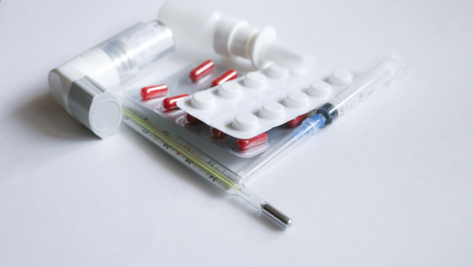 Set of medications - Pills, syringe, inhaler, thermometer, spray on white background