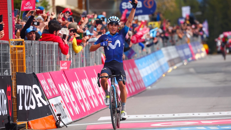 Movistar Team's Colombian rider Einer Rubio celebrates as he crosses the finish line to win the thirteenth stage of the Giro d'Italia 2023 cycling race, which start was transfered from Borgofranco d'Ivrea to Le Chable in Switzerland due to bad weather conditions, and Crans-Montana, on May 19, 2023. (Photo by Luca Bettini / AFP)