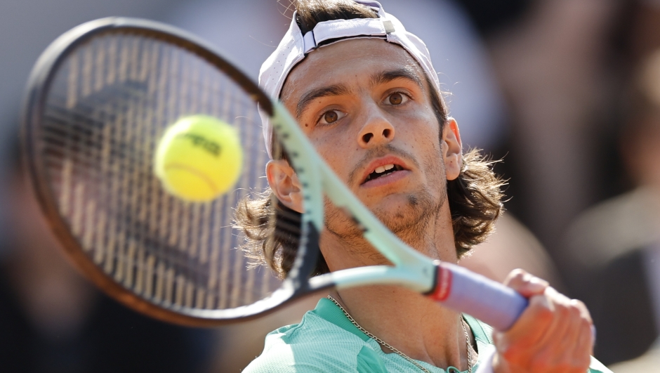 Italy's Lorenzo Musetti plays a shot against Sweden's Mikael Ymer during their first round match of the French Open tennis tournament at the Roland Garros stadium in Paris, Sunday, May 28, 2023. (AP Photo/Jean-Francois Badias)