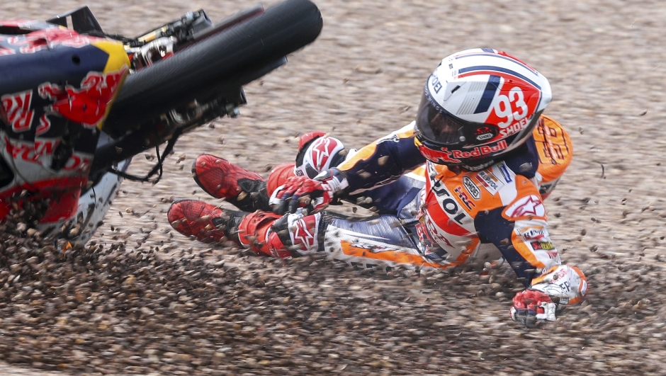 Marc Marquez from Spain on his Repsol Honda falls in the gravel during qualifying practice for the German Grand Prix at the Sachsenring in  Hohenstein-Ernstthal, Germany, Saturday, June 17, 2023. (Jan Woitas//dpa via AP)