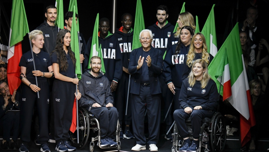 MILAN, ITALY - JUNE 17: Giorgio Armani and the team of paralympic athletes during the Emporio Armani Ready to Wear Spring/Summer 2024 fashion show as part of the Milan Men Fashion Week on June 17, 2023 in Milan, Italy. (Photo by Victor VIRGILE/Gamma-Rapho via Getty Images)