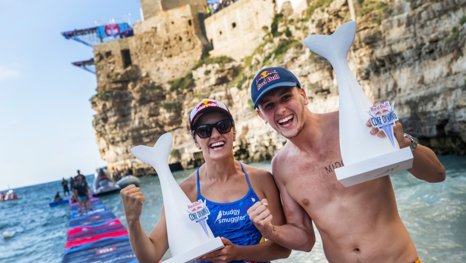 Rhiannan Iffland of Australia and Aidan Heslop of the UK celebrate during the final competition day of the third stop of the Red Bull Cliff Diving World Series in Polignano a Mare, Italy on July 2, 2023. // Romina Amato / Red Bull Content Pool // SI202307020601 // Usage for editorial use only //