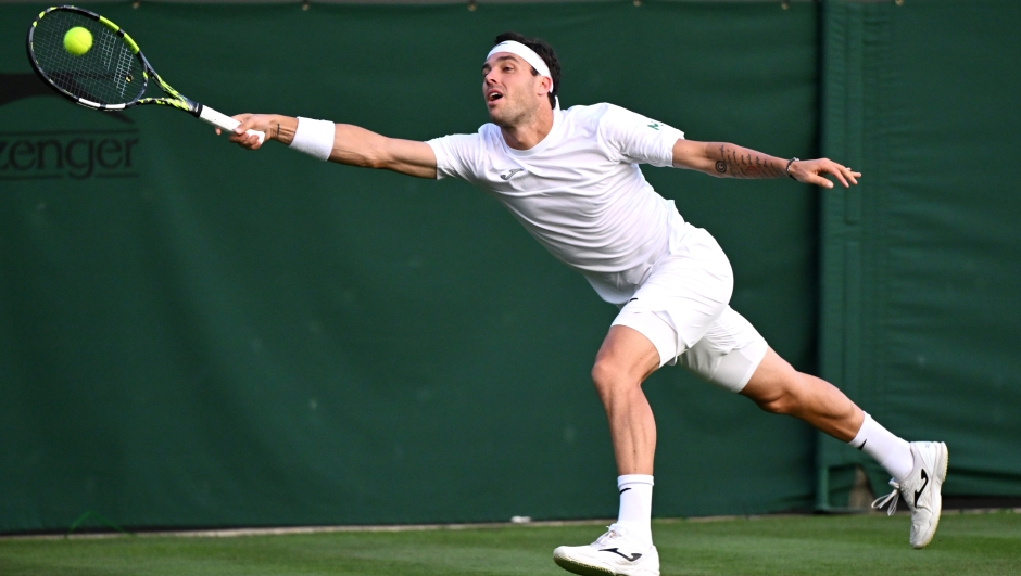 LONDON, ENGLAND - JULY 05: Marco Cecchinato of Italy plays a forehand against Nicolas Jarry of Chile in the Men's Singles first round match during day three of The Championships Wimbledon 2023 at All England Lawn Tennis and Croquet Club on July 05, 2023 in London, England. (Photo by Mike Hewitt/Getty Images)