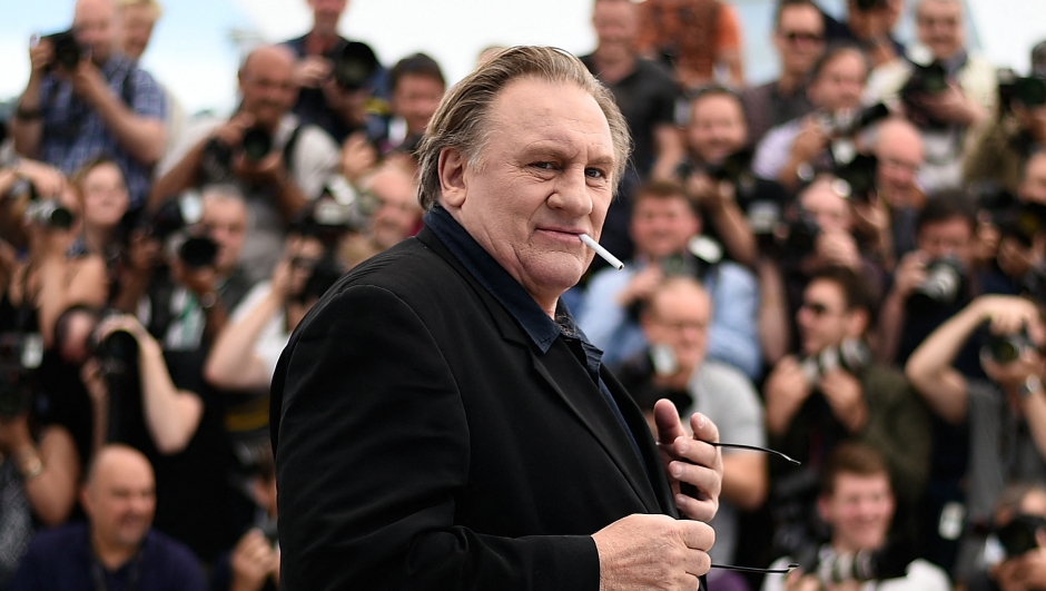 (FILES) In this file photo taken on May 22, 2015 French actor Gerard Depardieu poses during a photocall for the film "Valley of Love" at the 68th Cannes Film Festival in Cannes, southeastern France. - Thirteen women accuse Gerard Depardieu, already under investigation for suspicions of rape and sexual assault on the actress Charlotte Arnould, of sexual violence, according to a report by Mediapart. Contacted by AFP, the Paris prosecutor's office said on April 12, 2023 that it "has not yet received any new complaint", and specified that the investigation opened in July 2020 following the complaint of an actress, Charlotte Arnould, was continuing. (Photo by Loic VENANCE / AFP)