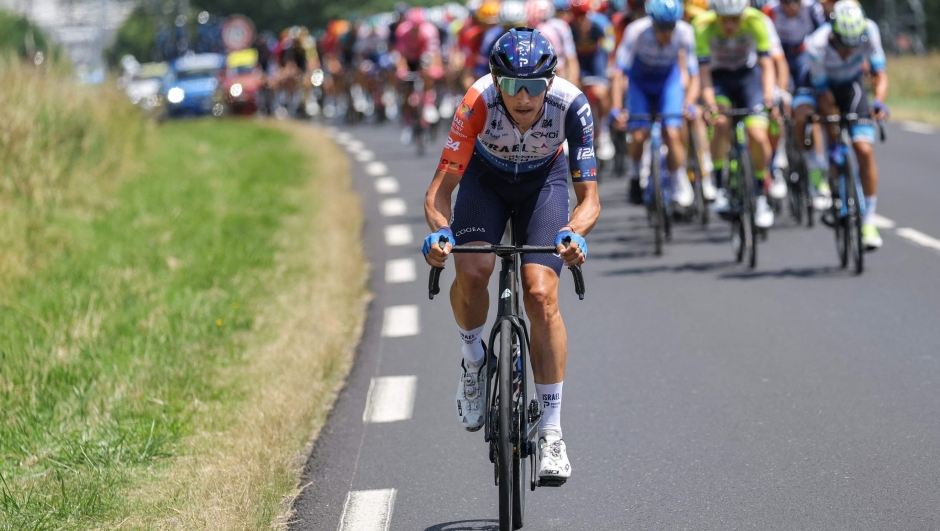 Israel - Premier Tech's Latvian rider Krists Neilands cycles ahead of the pack of riders during the 10th stage of the 110th edition of the Tour de France cycling race, 167,5 km between Vulcania and Issoire, in the Massif Central highlands in central France, on July 11, 2023. (Photo by Thomas SAMSON / AFP)