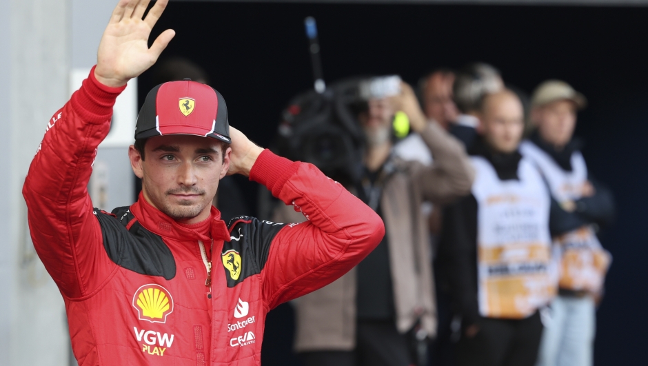 Ferrari driver Charles Leclerc of Monaco, who clocked the second fastest time in the qualification session waves from the parc ferme ahead of the Formula One Grand Prix at the Spa-Francorchamps racetrack in Spa, Belgium, Friday, July 28, 2023. The Belgian Formula One Grand Prix will take place on Sunday. (AP Photo/Geert Vanden Wijngaert)