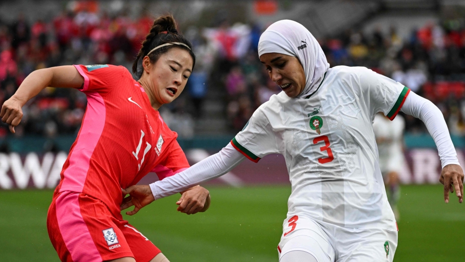 South Korea's forward #11 Choe Yu-Ri (L) and Morocco's defender #03 Nouhaila Benzina fight for the ball during the Australia and New Zealand 2023 Women's World Cup Group H football match between South Korea and Morocco at Hindmarsh Stadium in Adelaide on July 30, 2023. (Photo by Brenton EDWARDS / AFP)