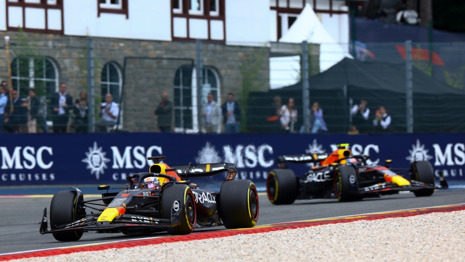 SPA, BELGIUM - JULY 30: Max Verstappen of the Netherlands driving the (1) Oracle Red Bull Racing RB19 led Sergio Perez of Mexico driving the (11) Oracle Red Bull Racing RB19 during the F1 Grand Prix of Belgium at Circuit de Spa-Francorchamps on July 30, 2023 in Spa, Belgium. (Photo by Mark Thompson/Getty Images)