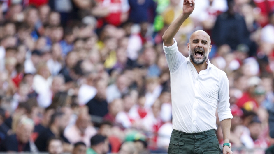 Manchester City's manager Pep Guardiola gives instructions to his players during the English FA Community Shield final soccer match between Arsenal and Manchester City at Wembley Stadium in London, Sunday, Aug. 6, 2023. (AP Photo/David Cliff)