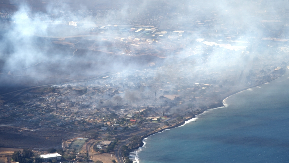 TOPSHOT - This handout photo courtesy of Carter Barto via Facebook shows an aerial view of smoke rising above as a wildfire burns in Lahaina, Hawaii, on August 9, 2023. At least six people have been killed in a wildfire that has razed the Hawaiian town of Lahaina, officials said on August 9, with desperate residents jumping into the ocean in a bid to escape the fast-moving flames. (Photo by HANDOUT / Carter Barto / AFP) / RESTRICTED TO EDITORIAL USE - MANDATORY CREDIT "AFP PHOTO / CARTER BARTO " - NO MARKETING - NO ADVERTISING CAMPAIGNS - DISTRIBUTED AS A SERVICE TO CLIENTS