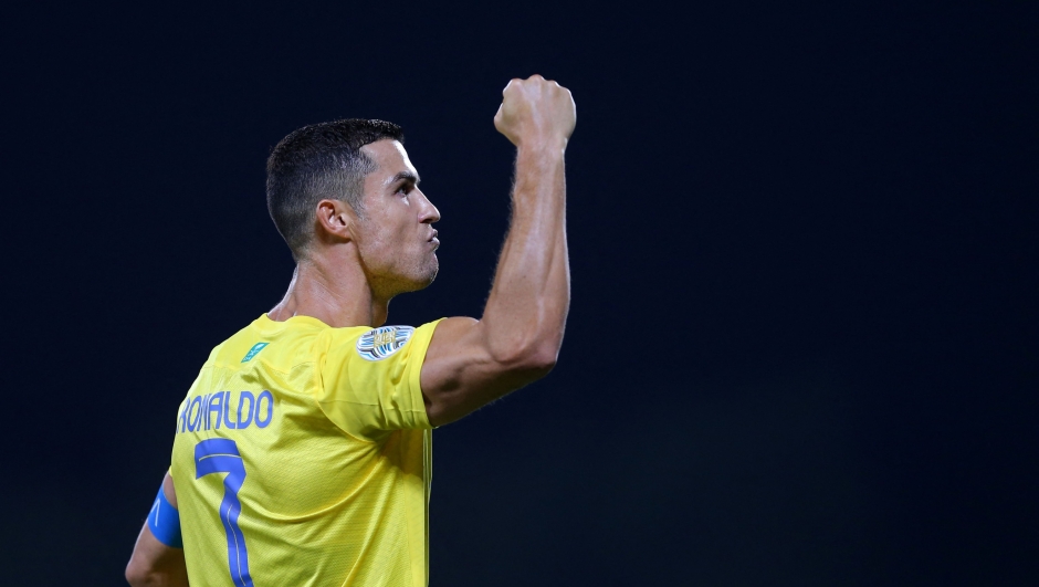 TOPSHOT - Nassr's Portuguese forward Cristiano Ronaldo celebrates after scoring his team's first goal during the 2023 Arab Club Champions Cup semi-final football match between Saudi Arabia's Al-Nassr and Iraq's Al-Shorta at Prince Sultan bin Abdul Aziz Stadium in Abha on August 9, 2023. (Photo by Abdullah Mahdi / AFP)