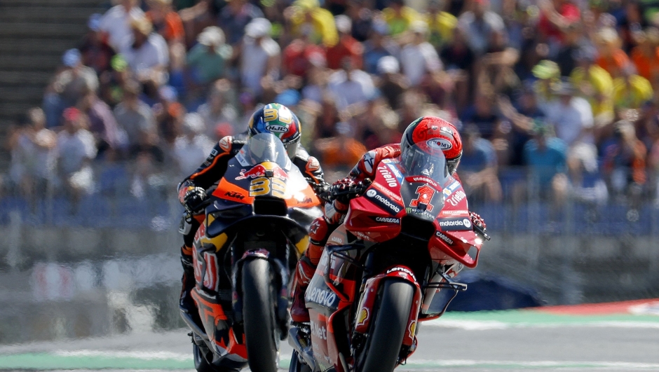 Ducati Lenovo Team Italian rider Francesco Bagnaia (R) and Red Bull KTM Factory Racing South African rider Brad Binder compete during the MotoGP Austrian Grand Prix at the Red Bull Ring racetrack in Spielberg bei Knittelfeld, Austria, on August 20, 2023. (Photo by ERWIN SCHERIAU / APA / AFP) / Austria OUT