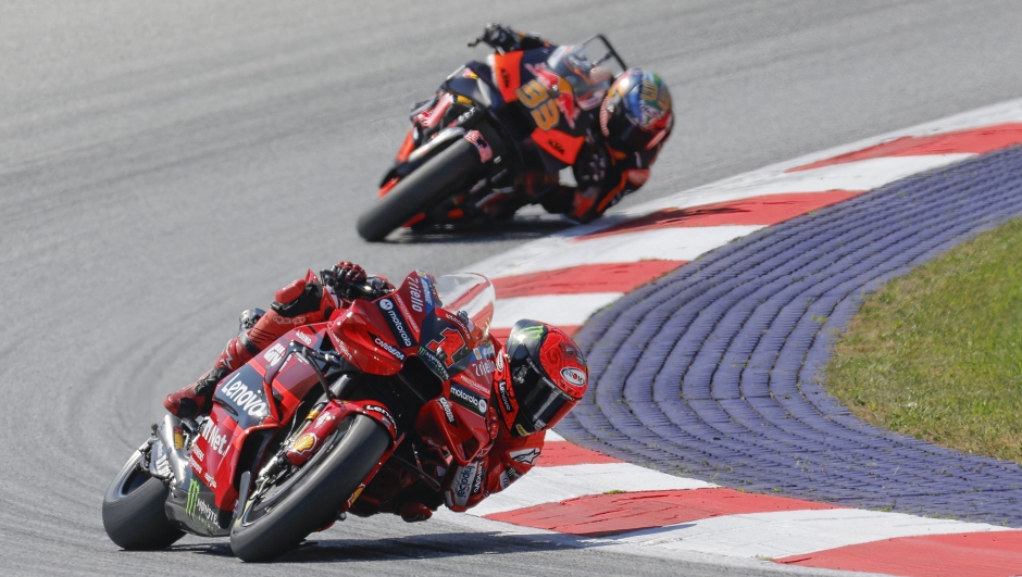 Ducati Lenovo Team Italian rider Francesco Bagnaia (R) and Red Bull KTM Factory Racing South African rider Brad Binder compete during the MotoGP Austrian Grand Prix at the Red Bull Ring racetrack in Spielberg bei Knittelfeld, Austria, on August 20, 2023. (Photo by ERWIN SCHERIAU / APA / AFP) / Austria OUT