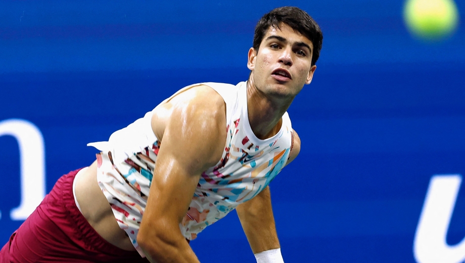 Spain's Carlos Alcaraz serves to Germany's Dominik Koepfer during the US Open tennis tournament men's singles first round match at the USTA Billie Jean King National Tennis Center in New York City, on August 29, 2023. (Photo by Kena BETANCUR / AFP)