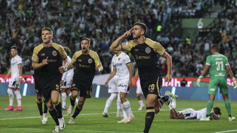 epa10824512 Sporting`s Paulinho (R) celebrates a goal against Famalicao during their Portuguese First League soccer match held at Alvalade Stadium, Lisbon, Portugal, 27 August 2023.  EPA/MIGUEL A. LOPES