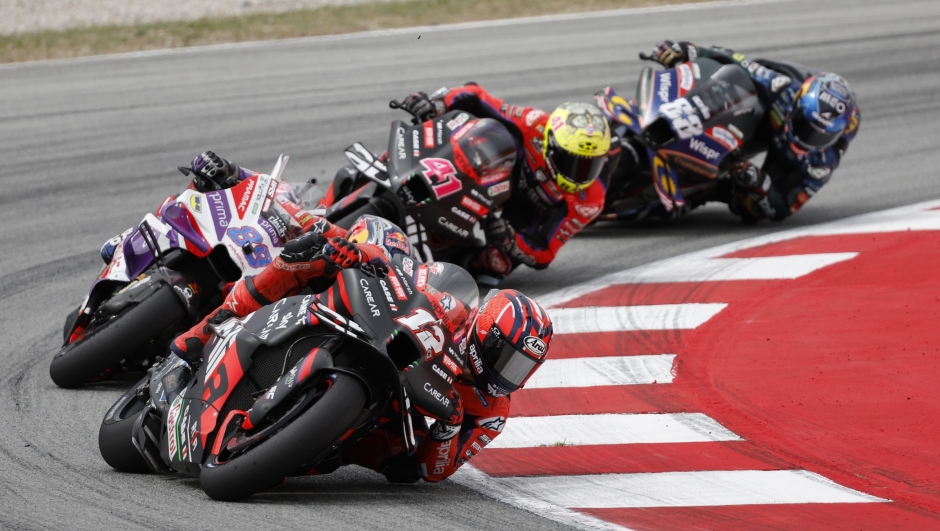 Spain's Maverick Vinales, right, takes a curve during the MotoGP race of the Catalunya Motorcycle Grand Prix at the Catalunya racetrack in Montmelo, just outside of Barcelona, Spain, Sunday, Sept. 3, 2023. (AP Photo/Joan Monfort)