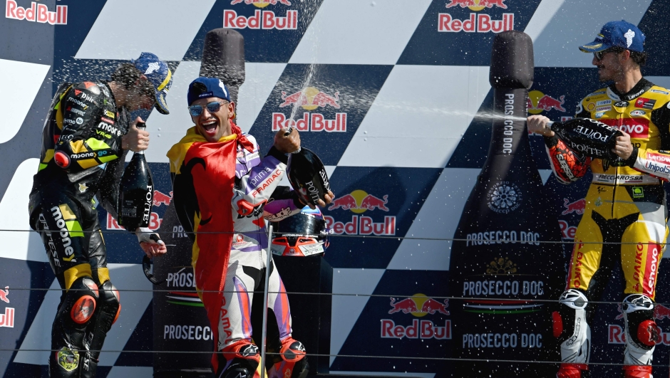 From left: Second placed Mooney VR46 Racing Team's Italian rider Marco Bezzecchi, winner Prima Pramac Racing's Spanish rider Jorge Martin and third place Ducati Lenovo Team's Italian rider Francesco Bagnaia, celebrate on the podium after the San Marino MotoGP Grand Prix at the Misano World Circuit Marco-Simoncelli in Misano Adriatico on September 10, 2023. (Photo by Filippo MONTEFORTE / AFP)
