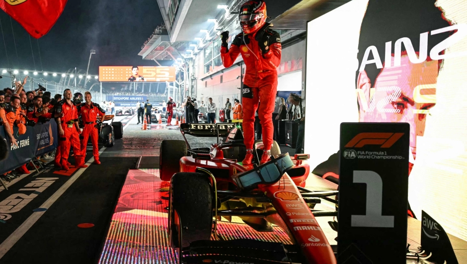 Ferrari's Spanish driver Carlos Sainz Jr celebrates winning the Singapore Formula One Grand Prix night race at the Marina Bay Street Circuit in Singapore on September 17, 2023. (Photo by MOHD RASFAN / AFP)