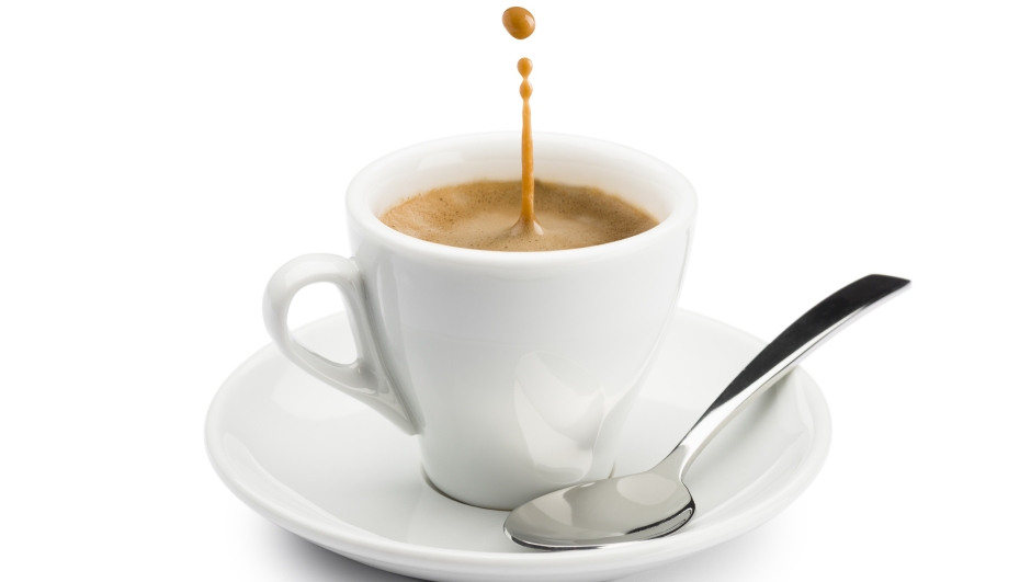 cup of coffee with splashing on white background