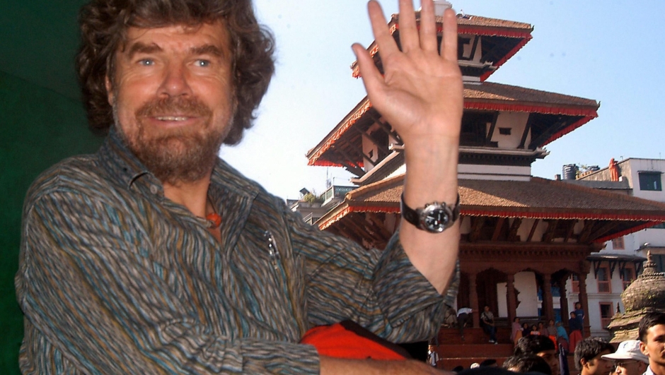 epa000296527 Tirolian mountaineer Reinhold Messner waves during the Mt. Cho Oyu Golden Jubilee Parade at Kathmandu Durbar Square in Kathmandu, Nepal on Monday 18 October 2004. Messner is the first man to conquer all peaks over eight thousand feet including the 8848 meter high Mount Everest.  EPA/NARENDRA SHRESTHA