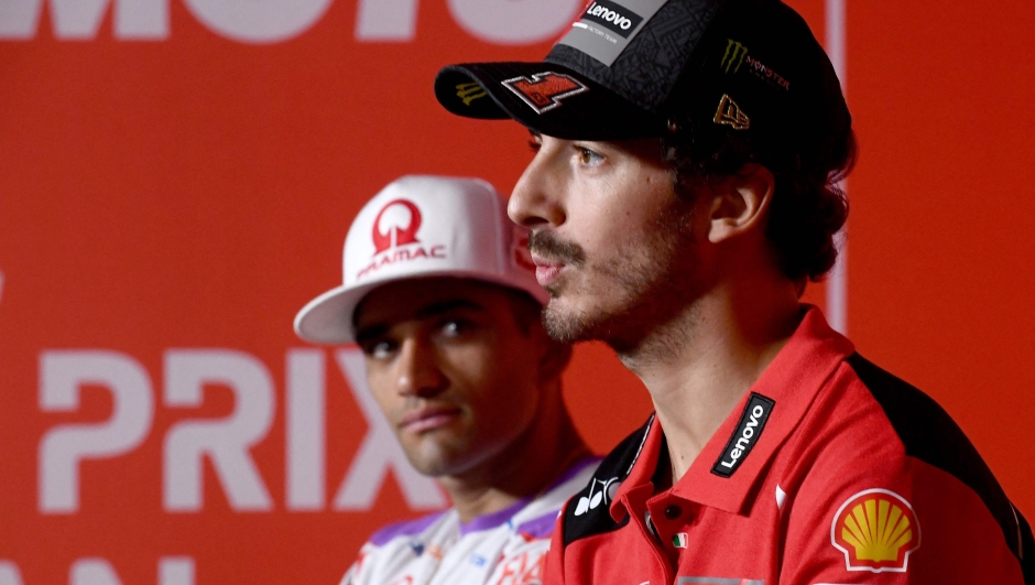 Ducati Lenovo Team rider Francesco Bagnaia of Italy (R) speaks as Prima Pramac Racing rider Jorge Martin of Spain (L) looks on during the pre-event press conference for October 1 MotoGP Japanese Grand Prix at the Mobility Resort Motegi in Motegi, Tochigi prefecture on September 28, 2023. (Photo by Toshifumi KITAMURA / AFP)