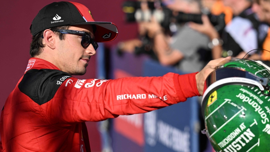 Ferrari's Monegasque driver Charles Leclerc greets fans after the qualifying session for the 2023 United States Formula One Grand Prix at the Circuit of the Americas in Austin, Texas, on October 20, 2023. (Photo by Jim WATSON / AFP)