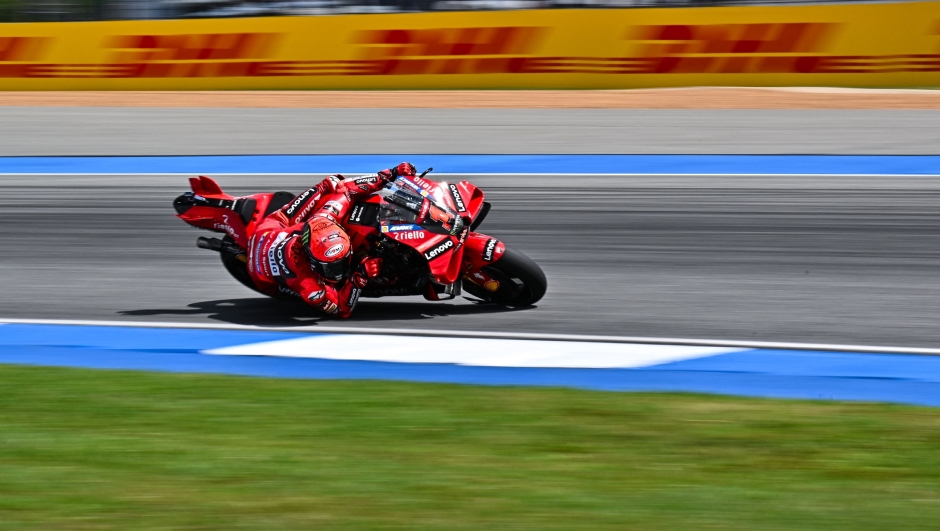 Ducati Lenovo Teams Italian rider Francesco Bagnaia rides his bike during the first free practice session of the MotoGP Thailand Grand Prix at the Buriram International Circuit in Buriram on October 27, 2023. (Photo by Lillian SUWANRUMPHA / AFP)