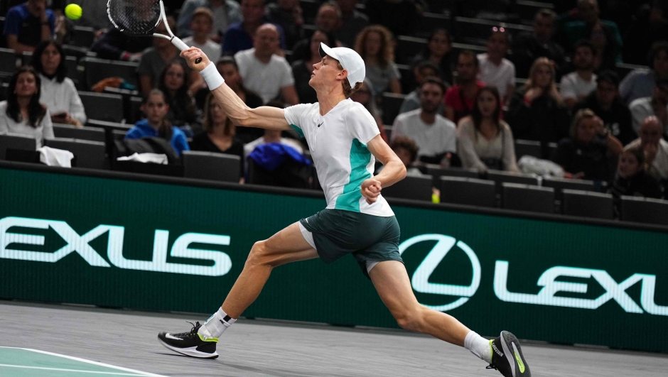 Italy's Jannik Sinner plays a forehand return to US' Mackenzie Mcdonald during their men's singles match on day three of the Paris ATP Masters 1000 tennis tournament at the Accor Arena - Palais Omnisports de Paris-Bercy - in Paris on November 1, 2023. (Photo by Dimitar DILKOFF / AFP)