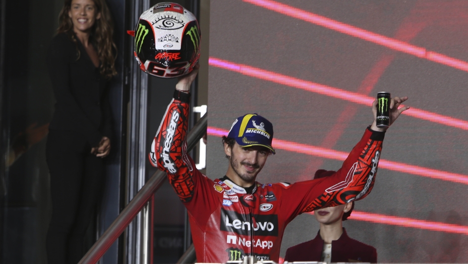 Second placed, Ducati rider Francesco Bagnaia, of Italy, celebrate on the podium end of the Qatari MotoGP Grand Prix at the Lusail International Circuit in Lusail, Qatar, Sunday, Nov. 19, 2023. (AP Photo/Hussein Sayed)   Associated Press/LaPresse Only Italy and Spain