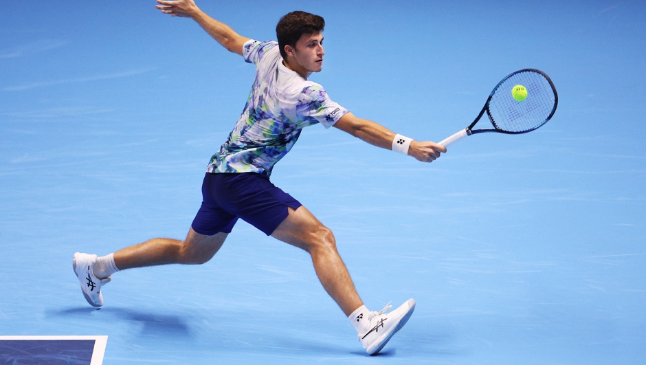 JEDDAH, SAUDI ARABIA - NOVEMBER 29:  Luca Nardi of Italy lunges for a backhand during his second round robin match against Dominic Stricker of Switzerlandduring day two of the Next Gen ATP Finals at King Abdullah Sports City on November 29, 2023 in Jeddah, Saudi Arabia. (Photo by Adam Pretty/Getty Images)