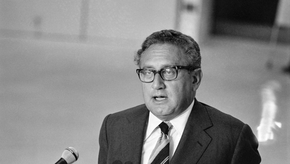 (FILES) US Secretary of State Henry Kissinger gives a speech at his arrival at the Orly airport, on September 6, 1976 for an official visit in France. Former US secretary of state Henry Kissinger, a key figure of American diplomacy in the post-World War II era, died November 29, 2023 at the age of 100, his association said. (Photo by AFP)