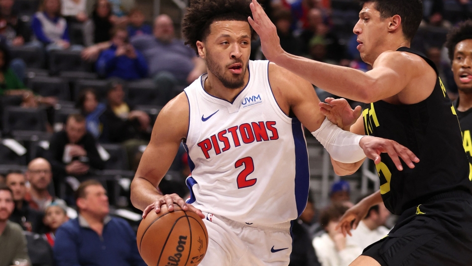 DETROIT, MICHIGAN - DECEMBER 21: Cade Cunningham #2 of the Detroit Pistons drives around Simone Fontecchio #16 of the Utah Jazz during the first half at Little Caesars Arena on December 21, 2023 in Detroit, Michigan. NOTE TO USER: User expressly acknowledges and agrees that, by downloading and or using this photograph, User is consenting to the terms and conditions of the Getty Images License Agreement.   Gregory Shamus/Getty Images/AFP (Photo by Gregory Shamus / GETTY IMAGES NORTH AMERICA / Getty Images via AFP)