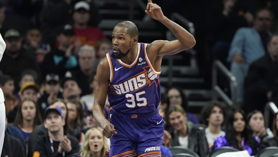 Phoenix Suns forward Kevin Durant (35) motions after a basket against the Indiana Pacers during the first half of an NBA basketball game, Sunday, Jan. 21, 2024, in Phoenix. (AP Photo/Matt York)