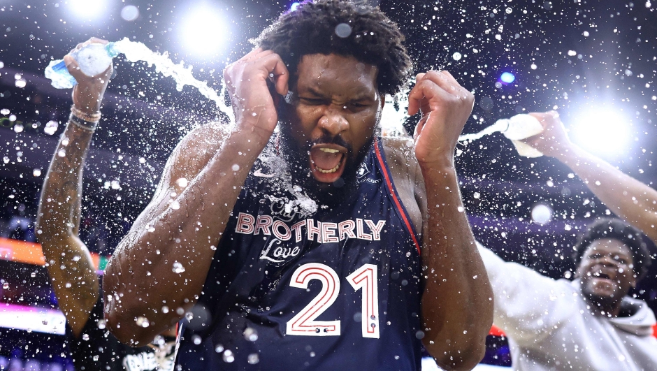 PHILADELPHIA, PENNSYLVANIA - JANUARY 22: Joel Embiid #21 of the Philadelphia 76ers reacts after being showered with water after defeating the San Antonio Spurs at the Wells Fargo Center on January 22, 2024 in Philadelphia, Pennsylvania. Embiid scored a franchise-record 70 points in the game. NOTE TO USER: User expressly acknowledges and agrees that, by downloading and or using this photograph, User is consenting to the terms and conditions of the Getty Images License Agreement.   Tim Nwachukwu/Getty Images/AFP (Photo by Tim Nwachukwu / GETTY IMAGES NORTH AMERICA / Getty Images via AFP)