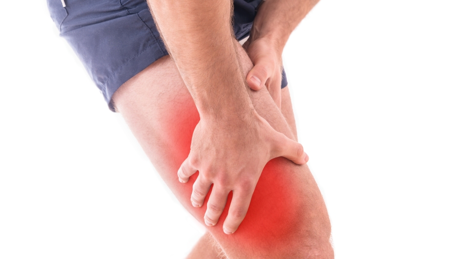 Man with quadriceps pain over white background