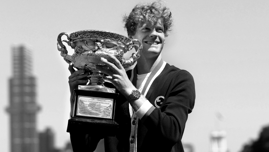MELBOURNE, AUSTRALIA - JANUARY 29: (EDITOR'S NOTE: Image converted to black and white) Jannik Sinner of Italy poses with the Norman Brookes Challenge Cup after winning the 2024 Australian Open Final, at Royal Botanic Gardens on January 29, 2024 in Melbourne, Australia. (Photo by Kelly Defina/Getty Images)