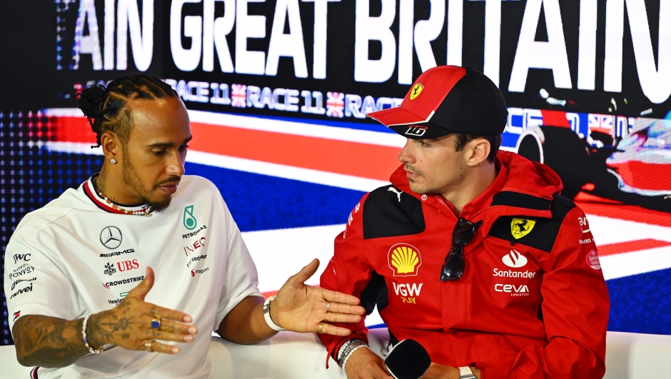 NORTHAMPTON, ENGLAND - JULY 06: Lewis Hamilton of Great Britain and Mercedes and Charles Leclerc of Monaco and Ferrari talk in the Drivers Press Conference during previews ahead of the F1 Grand Prix of Great Britain at Silverstone Circuit on July 06, 2023 in Northampton, England. (Photo by Dan Mullan/Getty Images)