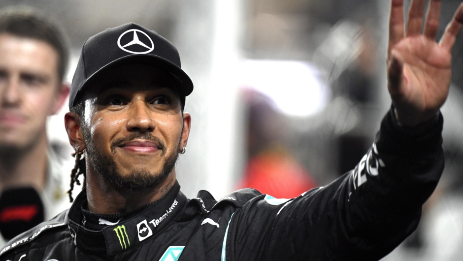 epa11118617 British Formula One driver Lewis Hamilton of Mercedes-AMG Petronas waves at parc ferme after taking the pole position in the qualifying for the 2021 Formula One Grand Prix of Saudi Arabia at the Jeddah Corniche Circuit in Jeddah, Saudi Arabia, 04 December 2021 (reissued 01 February 2024). British driver Lewis Hamilton will leave Mercedes-AMG Petronas after the upcoming 2024 season and sign with Scuderia Ferrari from 2025 on. The 39-year-old seven-times world champion's move was announced by Scuderia Ferrari in a statement on 01 February 2024.  EPA/STR *** Local Caption *** 57335517