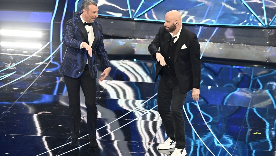 John Travolta and Amadeus perfermer during the 74th edition of the SANREMO Italian Song Festival at the Ariston Theatre in Sanremo, northern Italy - Tuesday, FEBRUARY 7, 2024. Entertainment. (Photo by Marco Alpozzi/LaPresse)  