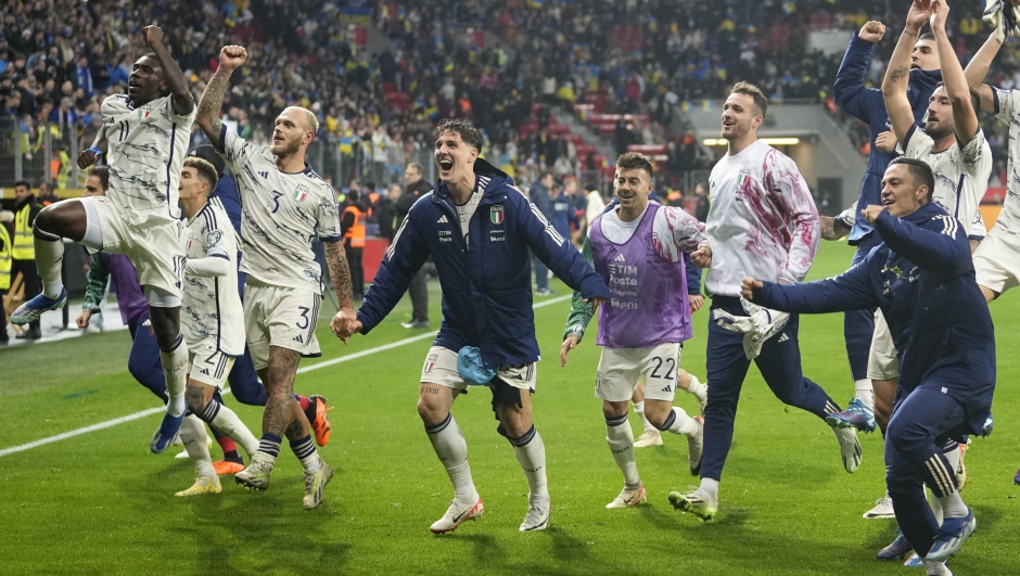 Italy players celebrate their qualifying after the Euro 2024 group C qualifying soccer match between Ukraine and Italy at the BayArena in Leverkusen, Germany, Monday, Nov. 20, 2023. (AP Photo/Martin Meissner)