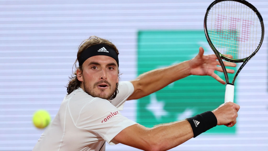PARIS, FRANCE - MAY 24: Stefanos Tsitsipas of Greece plays a backhand against Lorenzo Musetti of Italy during the Men's Singles First Round match on Day 3 of the French Open at Roland Garros on May 24, 2022 in Paris, France. (Photo by Clive Brunskill/Getty Images)
