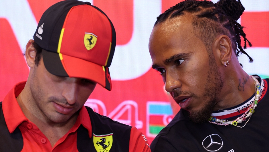 (FILES) Ferrari's Spanish driver Carlos Sainz Jr (L) and Mercedes' British driver Lewis Hamilton attend a press conference ahead of the Formula One Azerbaijan Grand Prix at the Baku City Circuit in Baku on April 27, 2023. Seven-time world champion Lewis Hamilton could be about to make a surprise switch to Ferrari for the 2025 Formula One season, according to several reports on February 1, 2024. The Italian team want the 39-year-old Briton to partner current driver Charles Leclerc, according to the BBC, Sky, Autosport, Italian newspaper Gazzetta dello Sport and other media. (Photo by Giuseppe CACACE / AFP)