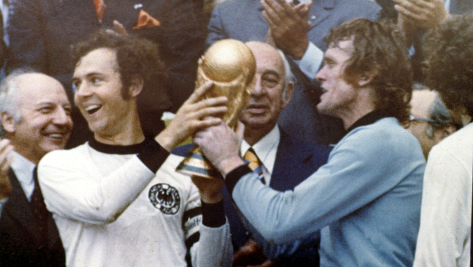 ** FILE ** West Germany's World Cup winning team captain Franz Beckenbauer holds the  World Cup soccer trophy with Germany's goalkeeper Sepp Maier, right, after their team's victory over Holland in the final at Munich Olympic Stadium, Germany, in this July 07, 1974 file photo. On Sunday, June 30, 2002 German national soccer team will play Brazil in the final of the soccer World Cup in Yokohma, Japan.  (AP Photo)