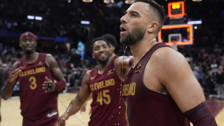 Cleveland Cavaliers guard Max Strus, right is doused by teammates as they celebrate his game-winning basket against the Dallas Mavericks in an NBA basketball game Tuesday, Feb. 27, 2024, in Cleveland. (AP Photo/Sue Ogrocki)