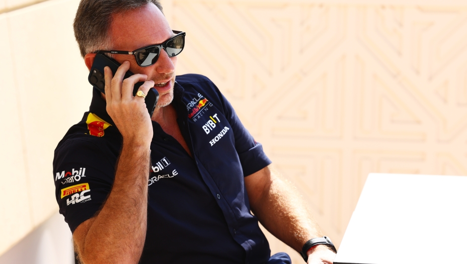 BAHRAIN, BAHRAIN - FEBRUARY 29: Oracle Red Bull Racing Team Principal Christian Horner talks on the phone in the Paddock prior to practice ahead of the F1 Grand Prix of Bahrain at Bahrain International Circuit on February 29, 2024 in Bahrain, Bahrain. (Photo by Mark Thompson/Getty Images)