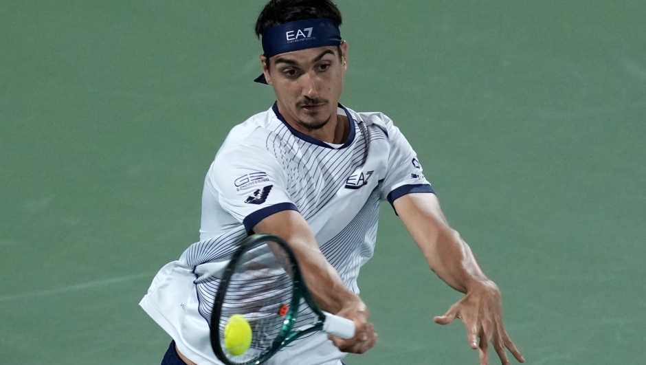 Lorenzo Sonego of Italy returns the ball to Daniil Medvedev during a match of the Dubai Duty Free Tennis Championships in Dubai, United Arab Emirates, Wednesday, Feb. 28, 2024. (AP Photo/Kamran Jebreili)